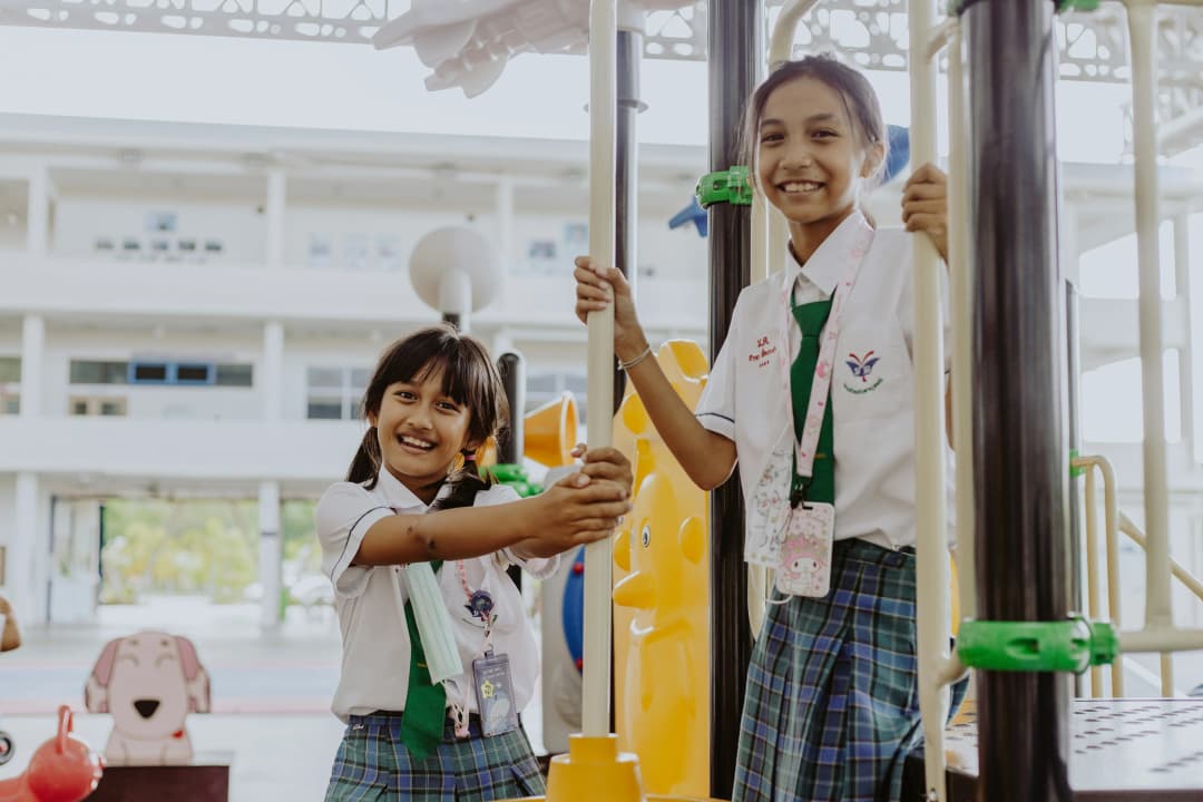 students in school playground playing