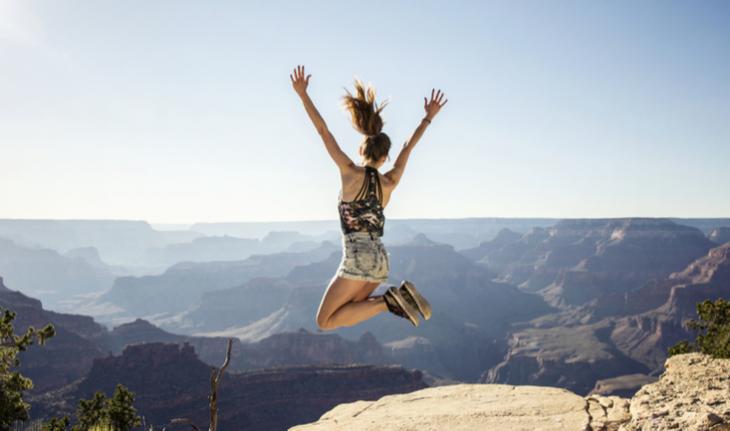 woman looking out at the view of monument valley