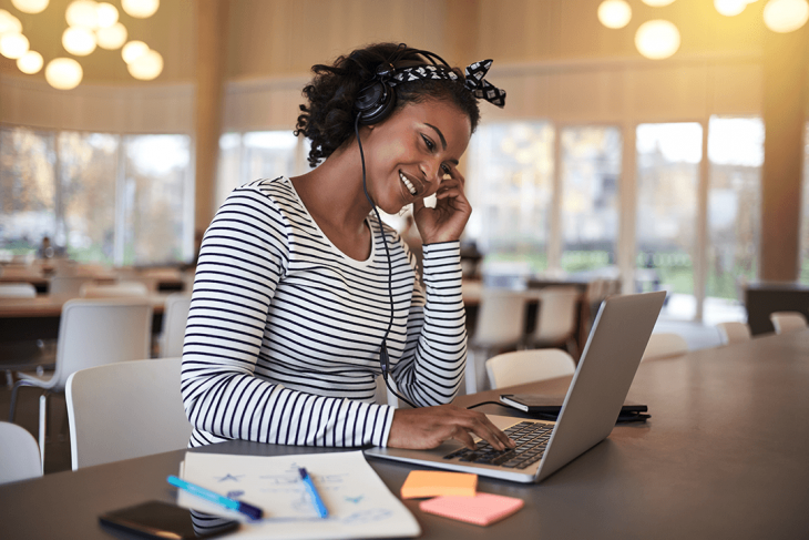 woman doing online TEFL course on laptop