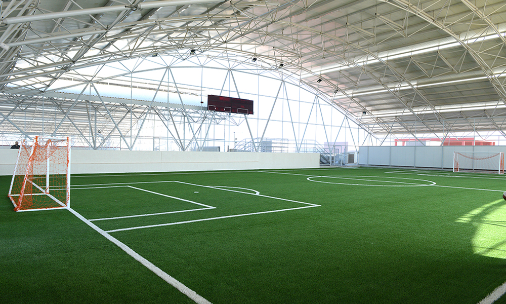 rooftop soccer field facilities at the american school of kuwait