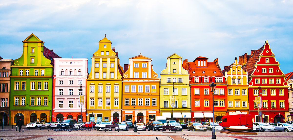 Row of colorful houses in Poland for educators looking for opportunities to Teach in Poland