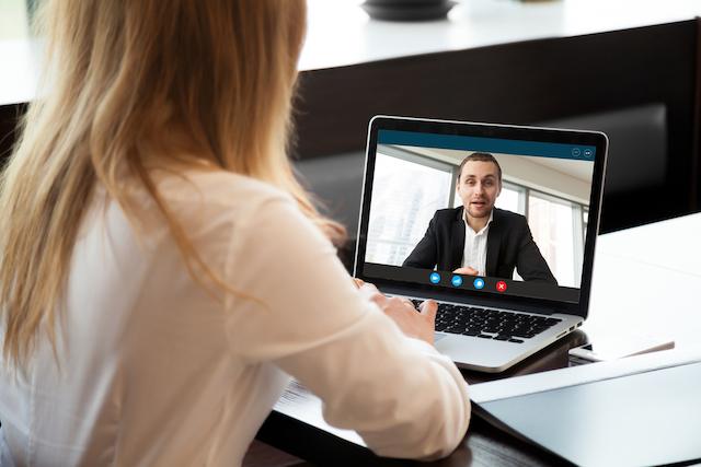 woman being interviewed virtually for an ESL job and landing that dream teach abroad job