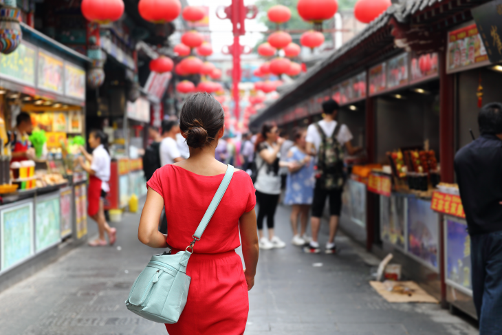 woman walking down street