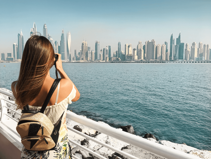 Girl in UAE by the water - Best Places to Teach English Abroad 2020
