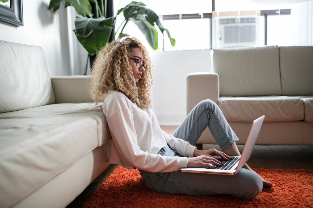 Woman looking up the best online teaching jobs of 2021.