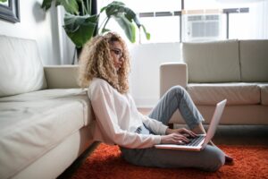 Woman looking up the best online teaching jobs of 2021.