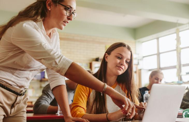 woman teaching students how to become a certified teacher online