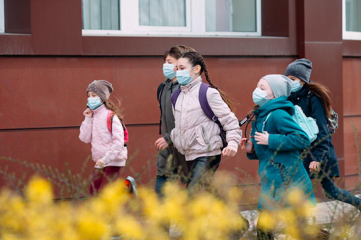 school children returning to school after covid
