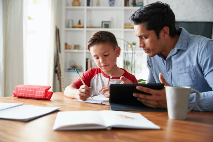 father teaching child at home - will online learning replace classroom teaching?