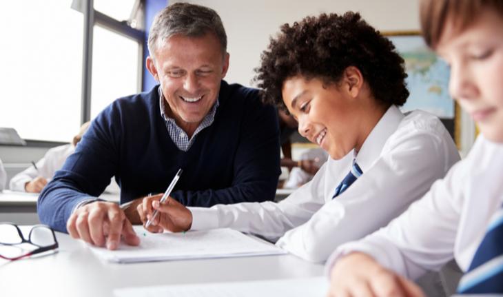 teacher helps student with homework
