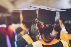 College grads at graduation - teaching after college.