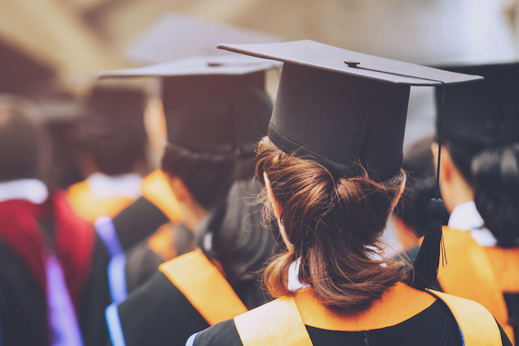 College grads at graduation - teaching after college.