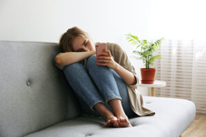 woman sitting alone on the couch