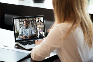 Virtual job fair - woman interviewing with school.