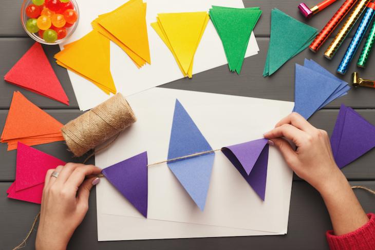 Teaching holding up props for teaching english online.