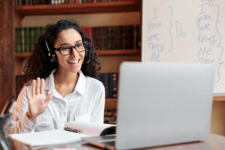 Photo of a teacher teaching English online full time.