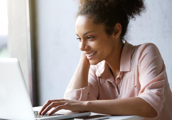 Woman looking up how to find students for online teaching.