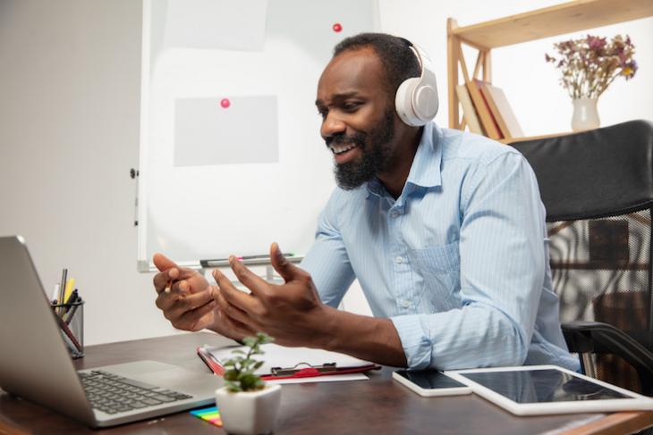 Man looking up how to find students for online teaching.