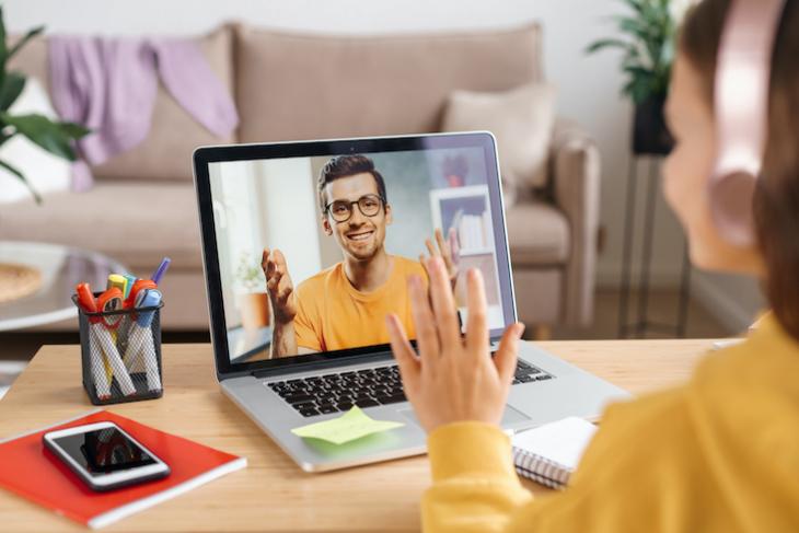 Photo of man teaching kids English online.