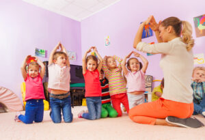 Teacher playing TEFL games for young learners.