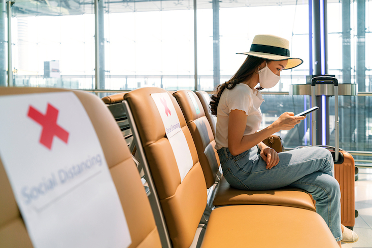 Photo of woman at the airport teaching abroad.