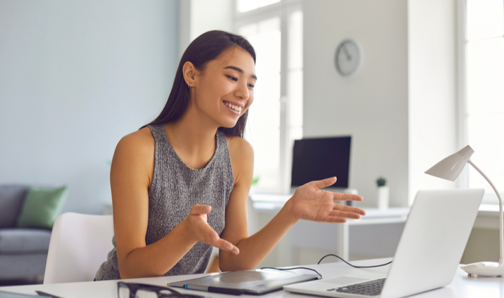 woman at laptop teaching english online
