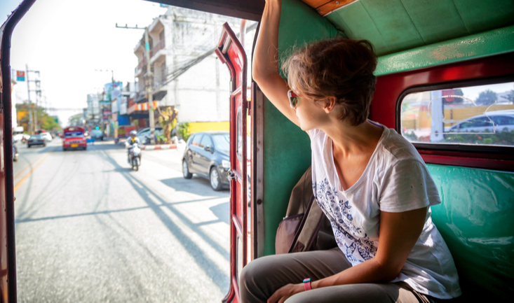 woman tourist in a moving taxi for cultural awareness article