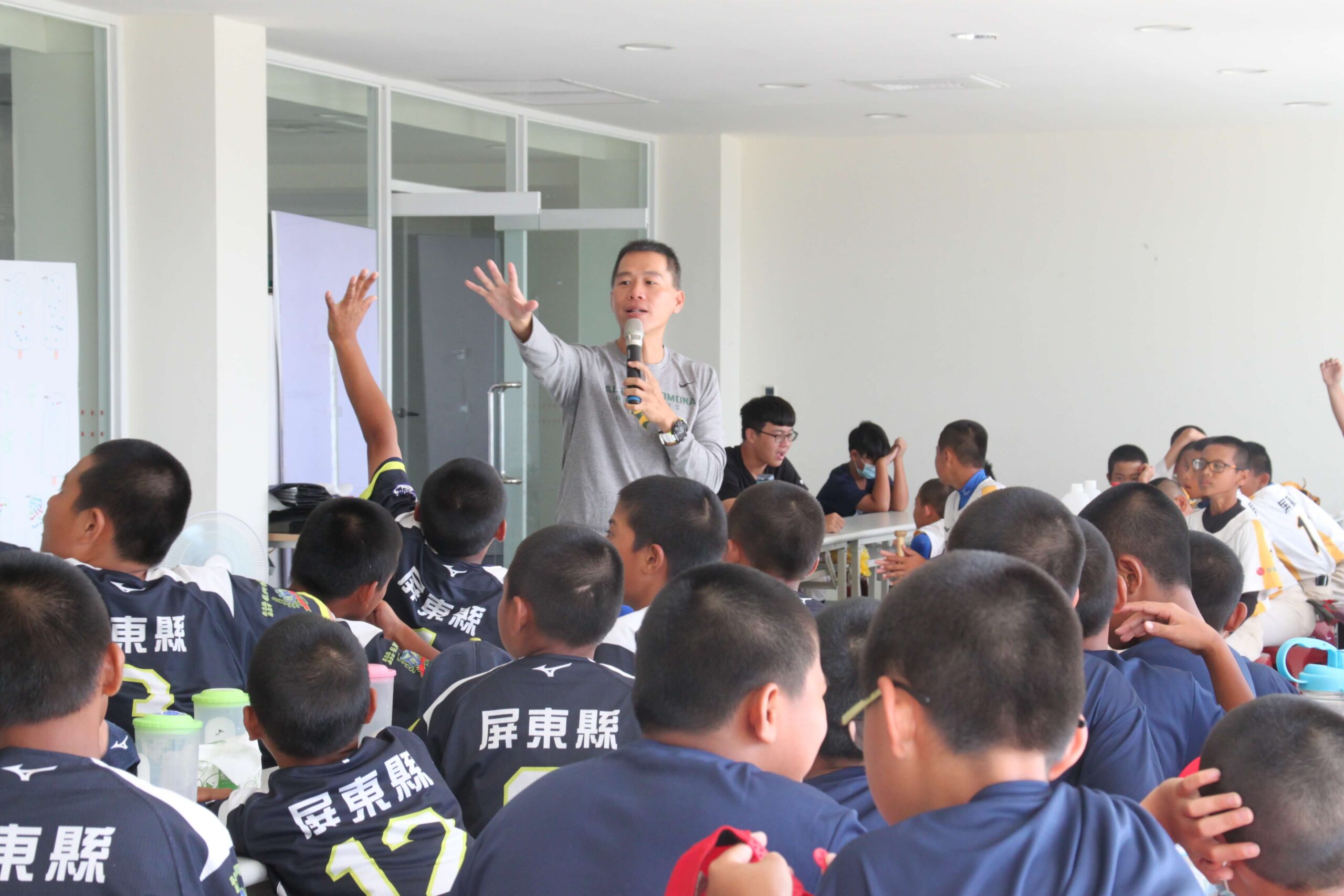 OISE TEFL certificate owner and graduate Ken Su in a classroom filled with students