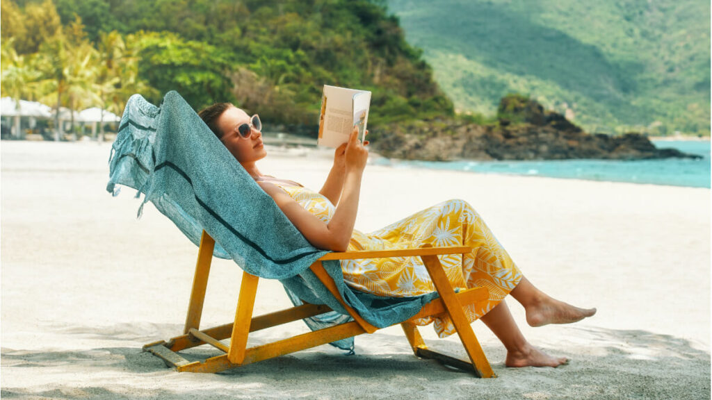 teacher abroad enjoying a book for national book lovers day