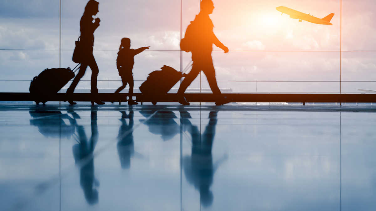 family travels through the airport