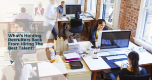 a strong workforce sitting in an office or workroom not being held back by unconscious bias in recruitment