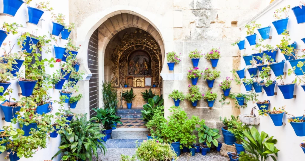 Cordoba, Andalusia Region, Spain. An old church with the traditional flowers set up of this town.