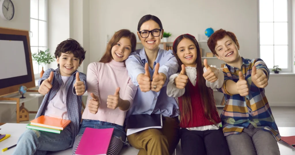 teacher scores school high on teacher job satisfaction pictured with students